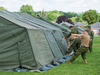 Canadian soldiers set up tents to house asylum seekers at the NAV centre in Cornwall, Ont.