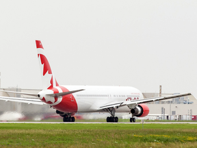 In this file photo, one of Air Canada Rouge's Boeing 767s sits at Montreal's Pierre Elliott Trudeau International Airport.