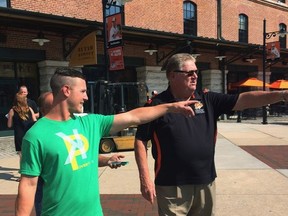Oakland Athletics leadoff hitter Boog Powell, left, and former Baltimore Orioles slugger Boog Powell meet outside Oriole Park at Camden Yards before the Athletics play the Orioles in Baltimore on Tuesday, Aug. 22, 2017. The name's the same, and they're both known for playing baseball. It's a bit early, however, to start comparing their home run swings. (AP Photo/David Ginsburg)