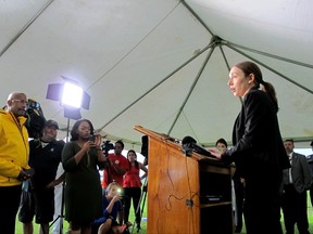 Florida Department of Corrections spokeswoman Michelle Glady addresses reporters after the execution of Mark Asay, Thursday, Aug. 24, 2017, in Starke, Fla. Asay was convicted by a jury of two 1987 Jacksonville murders that prosecutors said were racially motivated. The execution - Florida's first since the U.S. Supreme Court halted the practice in the state after finding its method for sentencing people to death to be unconstitutional - was carried out using etomidate, an anesthetic that has been approved by the Florida Supreme Court. Asay was also the first white man to be executed in Florida's history for killing a black man. (AP Photo/Jason Dearen)