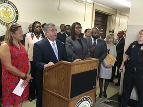 Acting Brooklyn District Attorney Eric Gonzalez, second left, discusses during a news conference, his office's request to dismiss about 143,000 arrest warrants for people who didn't pay tickets for minor offenses years ago, in Brooklyn, N.Y., Wednesday Aug. 9, 2017. He is flanked by New York City Council Speaker Melissa Mark-Viverito, left, and New York City Public Advocate Letitia James, third left. District attorneys in the Bronx, Manhattan and Queens boroughs made similar requests, resulting in courts throwing out a total of over 640,000 such warrants in a single day. (AP Photo/Jennifer Peltz)