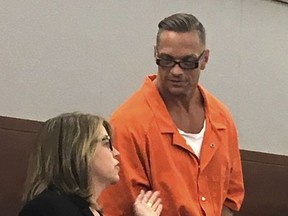 Nevada death row inmate Scott Raymond Dozier confers with Lori Teicher, a federal public defender involved in his case, during a Thursday, Aug. 17, 2017 appearance in Clark County District Court in Las Vegas. A date for Dozier's execution was pushed back one month, to mid-November, while defense attorneys challenge the state's lethal injection protocol. Dozier, who maintains that he wants to die, would become the first person executed in Nevada since 2006. (AP Photo/Ken Ritter)