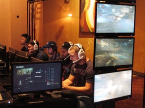 In this March 31, 2017 photo, video game players compete against one another in an esports tournament at Caesars casino in Atlantic City, N.J. Casinos are slowly embracing esports as a way to help their bottom line, but so far, the money is coming from renting hotel rooms to the young players and selling them food and drinks, not from turning them into gamblers. (AP Photo/Wayne Parry)