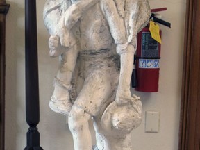 This Aug. 21, 2017 photo shows a plaster model of a Boy Scout carrying another scout in Barre, Vt., which was to have served as the model for a granite statue. The project was abandoned in 1941 after the death of the original artist. Now people in the community are working to finish the project. (AP Photo/Wilson Ring)