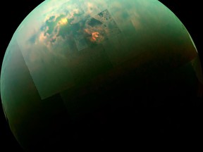 This near-infrared, color view from Cassini shows the sun glinting off Titan's north polar seas.