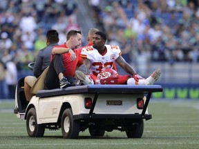Kansas City Chiefs running back Spencer Ware is taken off the field on a cart after an injury during the first half of an NFL football preseason game against the Seattle Seahawks, Friday, Aug. 25, 2017, in Seattle. (AP Photo/John Froschauer)