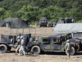 U.S. Army soldiers prepare for their military exercise in Paju, South Korea, near the border with North Korea, Saturday, Aug. 26, 2017. Three North Korea short-range ballistic missiles failed on Saturday, U.S. military officials said, which, if true, would be a temporary setback to Pyongyang's rapid nuclear and missile expansion. (AP Photo/Ahn Young-joon)