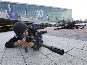 South Korean police officers aim their machine guns during an anti-terror drill as part of Ulchi Freedom Guardian exercise, in Goyang, South Korea, Monday, Aug. 21, 2017. U.S. and South Korean troops kicked off their annual drills Monday that come after U.S. President Donald Trump and North Korea exchanged warlike rhetoric in the wake of the North's two intercontinental ballistic missile tests last month. (AP Photo/Ahn Young-joon)