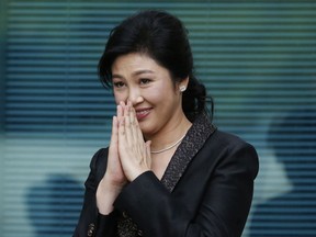 In this Aug. 1, 2017 photo, Thailand's former Prime Minister Yingluck Shinawatra arrives at the Supreme Court for to make final statement of the hearing in Bangkok, Thailand. Friends and foes alike of Yingluck Shinawatra, are anxiously awaiting a verdict Friday, Aug. 25, 2017 by the country's Supreme Court on charges that she was criminally negligent in implementing a rice subsidy program that is estimated to have cost the government as much as $17 billion and could now cost her 10 years in prison. (AP Photo/Sakchai Lalit)