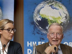 Alice Weidel, left, and Alexander Gauland, right, top candidates of the German AfD (Alternative for Germany) party for the upcoming general elections, attend a press conference in Berlin, Germany, Monday, Aug. 21, 2017. (AP Photo/Michael Sohn)