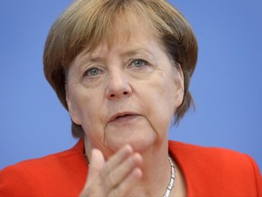 German Chancellor Angela Merkel gestures during her annual press conference at the Federal Press Conference in Berlin, Germany, Tuesday, Aug. 29, 2017. (AP Photo/Michael Sohn)