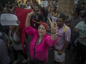 Hundreds of people attend a protest by the Muslim community condemning an attack in Barcelona, Spain, Monday Aug. 21, 2017. The lone fugitive from the Spanish cell that killed 15 people in and near Barcelona was shot to death Monday after he flashed what turned out to be a fake suicide belt at two troopers who confronted him in a vineyard just outside the city he terrorized, authorities said. (AP Photo/Santi Palacios)