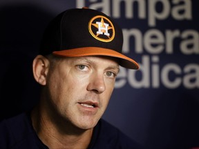 Houston Astros manager A.J. Hinch speaks to the media before a baseball game against the Texas Rangers Wednesday, Aug. 30, 2017, in St. Petersburg, Fla. The Astros moved their three-game home series against the Rangers to St. Petersburg after being displaced by Hurricane Harvey. Hitch announced the team would be returning to Houston after Thursday's game in St. Petersburg. (AP Photo/Chris O'Meara)