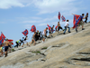 Confederate flag supporters climb Stone Mountain in Georgia to protest of what they believe is an attack on their Southern heritage, Aug. 1, 2015.