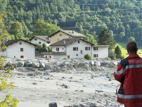 A photo taken Wednesday, Aug. 23, 2017 shows a landslide that hit the village Bondo in southern Switzerland