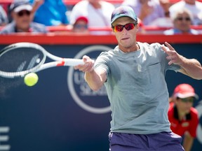 In this Au.g 9 file photo, Peter Polansky returns a shot to Roger Federer at the Rogers Cup.
