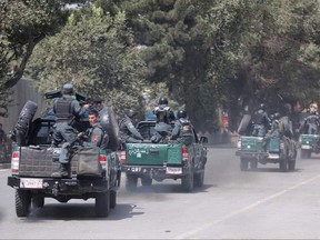 Afghan security personnel arrive at the site of an explosion near a bank in Kabul, Afghanistan, Tuesday, Aug. 29, 2017.  The area where the explosion took place, in the center of the Afghan capital, is home to many businesses. The U.S. Embassy and the NATO headquarters are about 500 meters (yards) away.  (AP Photo/Rahmat Gul)