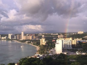 A rainbow appears over Tumon Bay, Guam Sunday.