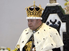 FILE - In this July 4, 2015, file photo, newly crowned King Tupou VI sits during his coronation at Centenary Church in Nuku'alofa, Tonga. The king of the small Pacific nation of Tonga on Friday, Aug. 25, 2017, took the extraordinary step of dissolving the nation's parliament and ordering new elections held by Nov. 16, 2017. (Linny Folau/Magangi Tonga via AP, File)