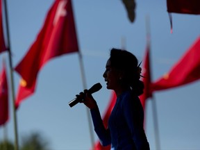 In this Oct. 17, 2015 photo, Aung San Suu Kyi speaks during a campaign rally for her National League for Democracy party in Thandwe, western Rakhine state, Myanmar. Hailed as a liberator from Myanmar's decades-long military rule, Aung San Suu Kyi is facing new criticism for failing to protect human rights she once so passionately espoused. Defenders say she can't risk alienating the still-powerful military. Critics wonder if she's forsaken her democratic ideals. (AP Photo/Gemunu Amarasinghe)