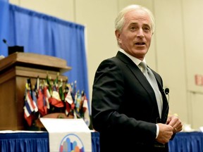 U.S. Sen. Bob Corker, R-Tenn., takes questions from attendees at the Rotary Club of Chattanooga, Thursday, Aug. 17, 2017, at the Chattanooga, Tenn., Convention Center. Corker delivered a blistering rebuke of President Donald Trump, saying he's not yet demonstrated the stability or competence that's required for an American president to succeed. (Tim Barber/Chattanooga Times Free Press via AP)