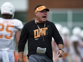 Tennessee head coach Butch Jones yells to players during fall NCAA college football practice in Knoxville, Tenn., Friday, Aug. 11, 2017. (Caitie McMekin/Knoxville News Sentinel via AP)