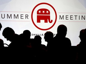 People talk before the start of the meeting of the standing committee on rules at the Republican National Committee summer meeting, Thursday, Aug. 24, 2017, in Nashville, Tenn. (AP Photo/Mark Humphrey)