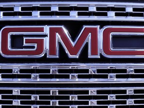 In this April 25, 2017, photo, a GMC truck sits in a General Motors dealer's lot in Nashville, Tenn. U.S. sales of new cars and trucks were expected to show a decline in July 2017 as consumers pulled back on purchases and waited for Labor Day deals. July likely marked the seventh straight month of declines in a peaking market. (AP Photo/Mark Humphrey)