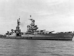 In this July 10, 1945, photo provided by U.S. Navy media content operations, USS Indianapolis (CA 35) is shown off the Mare Island Navy Yard, in Northern California, after her final overhaul and repair of combat damage. Civilian researchers say they have located the wreck of the USS Indianapolis, the World War II heavy cruiser that played a critical role in the atomic bombing of Hiroshima before being struck by Japanese torpedoes. The Indianapolis, with 1,196 sailors and Marines on board, was sailing the Philippine Sea between Guam and Leyte Gulf when two torpedoes from a Japanese submarine struck just after midnight on July 30, 1945. (U.S. Navy via AP)