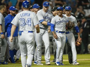 Toronto Blue Jays pitcher Marcus Stroman is restrained after a confrontation with the Chicago White Sox on Aug. 1.
