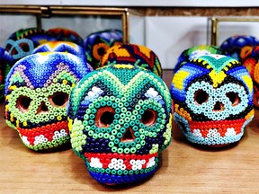 Small clay skulls decorated with tiny beads