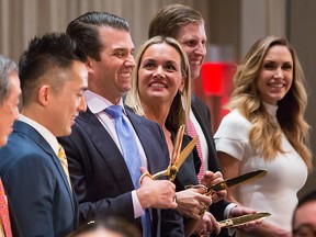 Donald Trump Jr.,  executive vice president of Trump Organization Inc., his wife Vanessa Trump, Eric Trump,  executive vice president of Trump Organization Inc., and his wife Lara Yunaska Trump, participate in the ribbon cutting ceremony during the grand opening of Trump International Hotel & Tower in Vancouver, on Tuesday, Feb. 28, 2017. Trump International Hotel & Tower Vancouver is the first new hotel to bear the name of Trump since he took office.