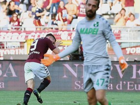 Torino's Andrea Belotti, left, celebrates after scoring during the Serie A soccer match between Torino and Sassuolo, at the Olympic stadium in Turin, Italy, Sunday, Aug. 27, 2017.  (Alessandro Di Marco/ANSA via AP)