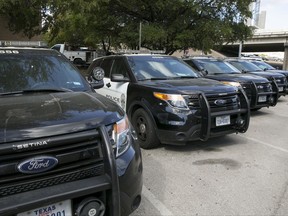 FILE - In this Tuesday, July 11, 2017, file photo, Austin police Ford utility vehicles are parked on East Eighth Street outside police headquarters in Austin, Texas. Ford Motor Co. has begun repairing Ford Explorer SUVs in Austin that were pulled off police duty because exhaust containing carbon monoxide was seeping into them. But the company faces lingering questions about the safety of thousands of other Explorers on the road. Ford says it's still investigating complaints of exhaust fumes in its non-police Explorers. (Jay Janner/Austin American-Statesman via AP, File)