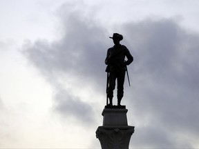 S Confederate Soldier Statue stands tall on the Texas Brigade monument on the east side of the Texas State Capitol in Austin, Texas.