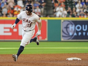 Houston Astros' Tyler White rounds the bases after hitting a solo home run off Toronto Blue Jays starting pitcher Marco Estrada during the third inning of a baseball game, Saturday, Aug. 5, 2017, in Houston. (AP Photo/Eric Christian Smith)