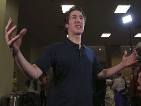 CORRECTS TO JOEL OSTEEN-Pastor Joel Osteen gives an interview at his Lakewood Church in Houston, Texas, Tuesday, Aug. 29, 2017. Osteen and his congregation have set up their church as a shelter for evacuees from the flooding by Tropical Storm Harvey. (AP Photo/LM Otero)
