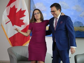 Canadian Foreign Minister Chrystia Freeland,left, greets Mexico Secretary of the Economy Ildefonso Guajardo Villarreal, at the Embassy of Canadian in Washington, Tuesday, Aug. 15, 2017.