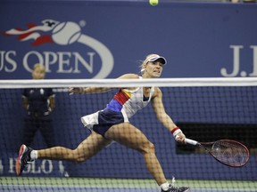 Angelique Kerber, of Germany, returns a shot from Naomi Osaka, of Japan, during the first round of the U.S. Open tennis tournament, Tuesday, Aug. 29, 2017, in New York. (AP Photo/Frank Franklin II)