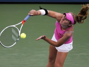 Allie Kiick, of the United States, serves to Daria Gavrilova, of Australia, during the first round of the U.S. Open tennis tournament, Wednesday, Aug. 30, 2017, in New York. (AP Photo/Andres Kudacki)