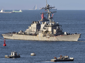 The damaged U.S. Navy destroyer USS Fitzgerald returns to its home port at U.S. Naval Yokosuka Base in Japan, June 17, 2017.