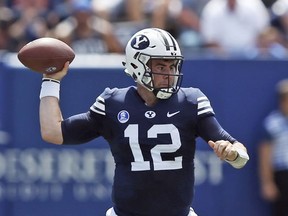 BYU quarterback Tanner Mangum (12) passes the ball against Portland State in the first half of an NCAA college football game, Saturday, Aug. 26, 2017, in Provo, Utah. (AP Photo/Rick Bowmer)