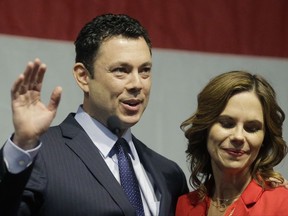 FILE - This May 20, 2017, file photo, U.S. Rep. Jason Chaffetz waves to the Utah GOP Convention while his wife Julie looks on in Sandy, Utah. A primary contest between three Republicans running for a Utah congressional seat held by Jason Chaffetz has tightened ahead of Tuesday's election, the winner of which is expected to cruise to victory in November's special election. Republicans outnumber Democrats five-to-one in Utah's 3rd Congressional District, which Chaffetz held before resigning this summer, citing a desire to be with his family. (AP Photo/Rick Bowmer, File)