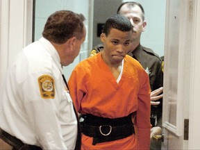 FILE - In this Oct. 26, 2004 file photo, Lee Boyd Malvo enters a courtroom in the Spotsylvania, Va., Circuit Court. Malvo plead guilty and was sentenced to two life sentences for the murder of Kenneth Bridges and shooting Caroline Seawell in 2002. In June 2017, public defender James Johnston argued before a Maryland judge that Malvo, one of the D.C. snipers who terrorized the Washington area for a month in 2002, deserved a new sentence. He was 17 and pleaded guilty to murder charges in Virginia and Maryland. He received life without parole in both states, but a Virginia judge recently ruled the term unconstitutional and ordered Malvo resentenced. (Mike Morones/The Free Lance-Star via AP)