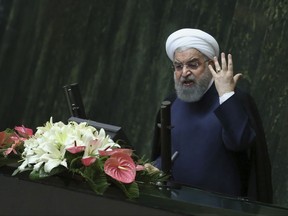 Iranian President Hassan Rouhani speaks at a session of parliament before a vote of confidence for his cabinet, in Tehran, Iran, Sunday, Aug. 20, 2017. Iranian lawmakers on Sunday approved 16 Cabinet members nominated by recently re-elected President Hassan Rouhani, including the first defense minister unaffiliated with the elite, hard-line Revolutionary Guard in 25 years. (AP Photo/Vahid Salemi)