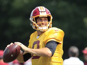 Washington Redskins starting quarterback Kirk Cousins (8) looks towards his receiver during practice at the team's NFL football training facility at Redskins Park in Ashburn, Va., ., Wednesday, Aug. 23, 2017. (AP Photo/Manuel Balce Ceneta)