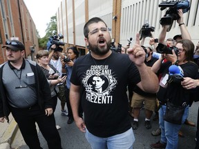 Matthew Heimbach voices his displeasure at the media after a court hearing for James Alex Fields Jr., in Charlottesville, Va., Monday, Aug. 14, 2017.