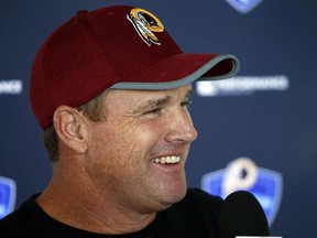 Washington Redskin head coach Jay Gruden smiles during a press conference prior to practice at the Washington Redskins NFL training camp in Richmond,. Va., Monday, July 31, 2017. (AP Photo/Steve Helber)