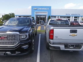 In this Wednesday, April 26, 2017, photo, vehicles are lined up in front of a Chevrolet dealership in Richmond, Va. On Friday, Aug. 25, 2017, the Commerce Department releases its July report on durable goods. (AP Photo/Steve Helber)