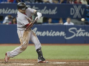 Christian  Vazquez of the Boston Red Sox unloads on a homer during MLB action against the Toronto Blue Jays Monday at Rogers Centre. Vazquez had four hits on the night as the Red Sox posted a 6-5 decision.